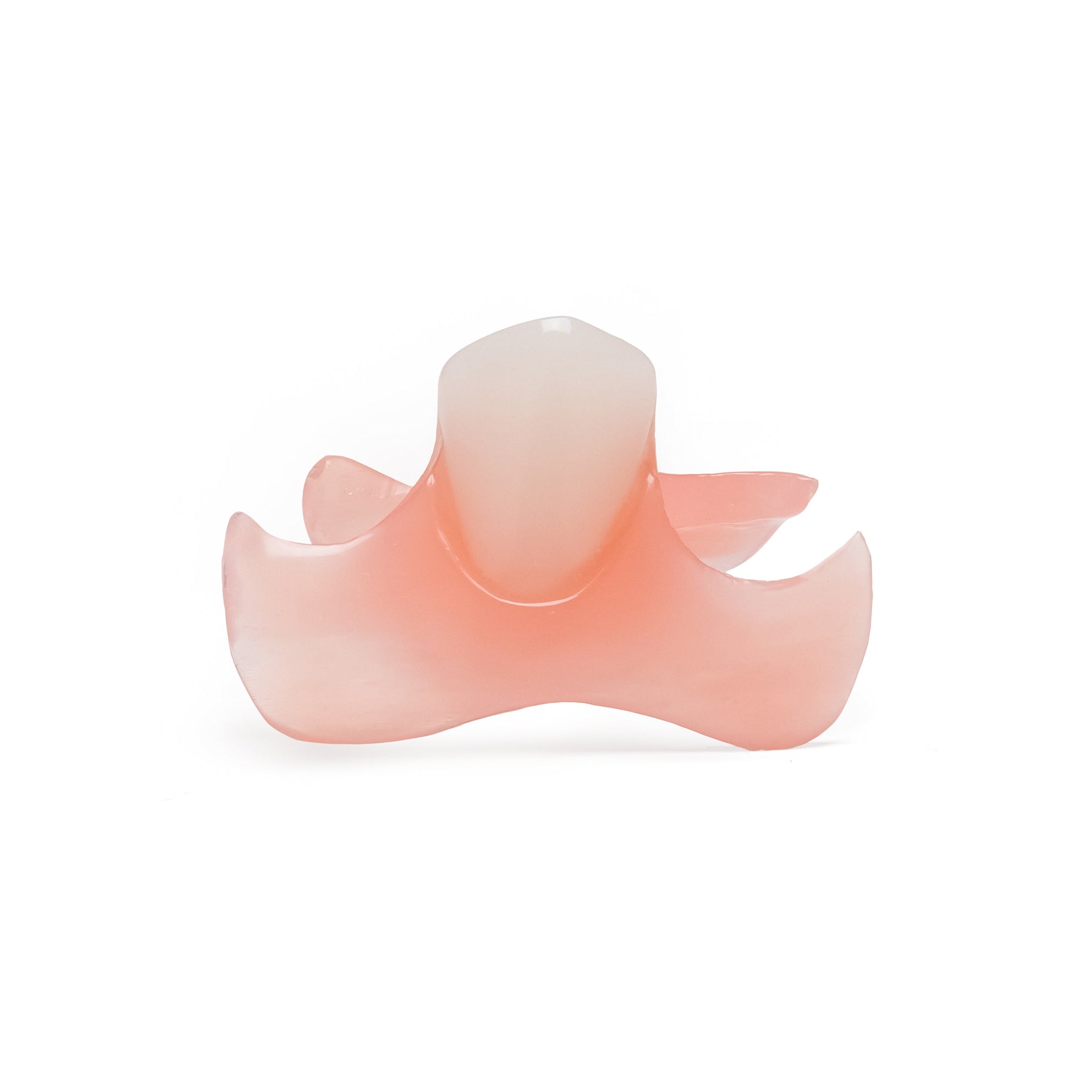 Single anterior front tooth flexible partial denture on white background.