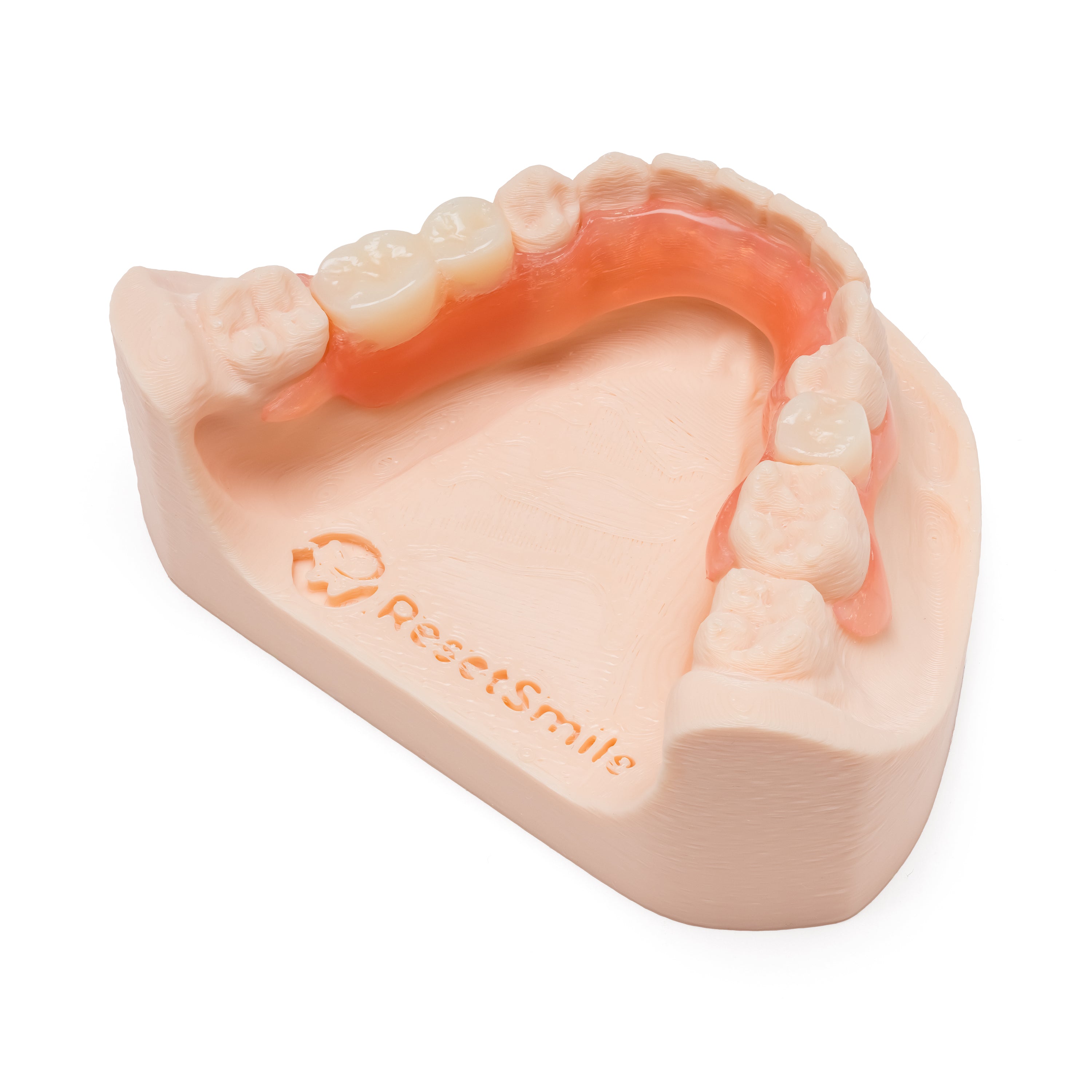 Pink and white partial denture with multiple teeth on a dental model on a white background